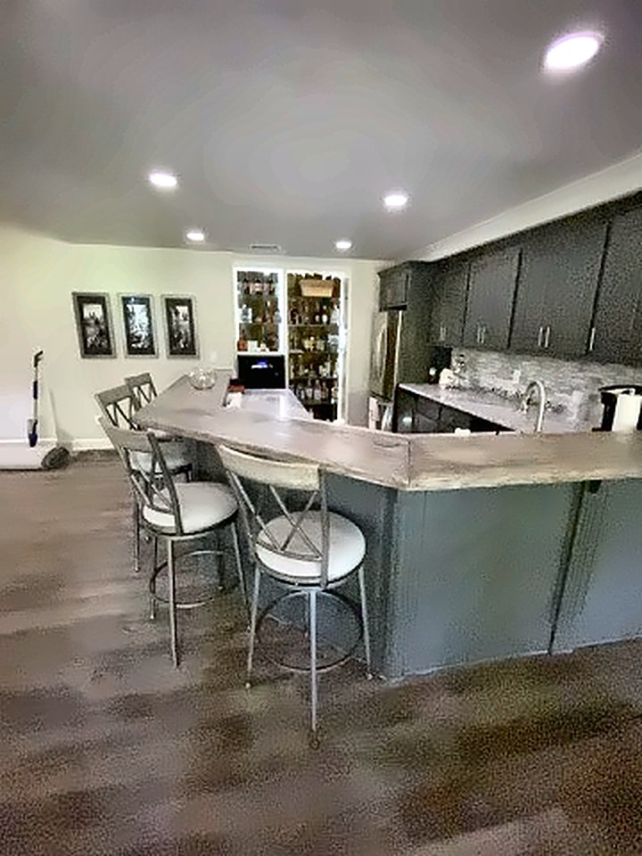 Finished basement bar with seating