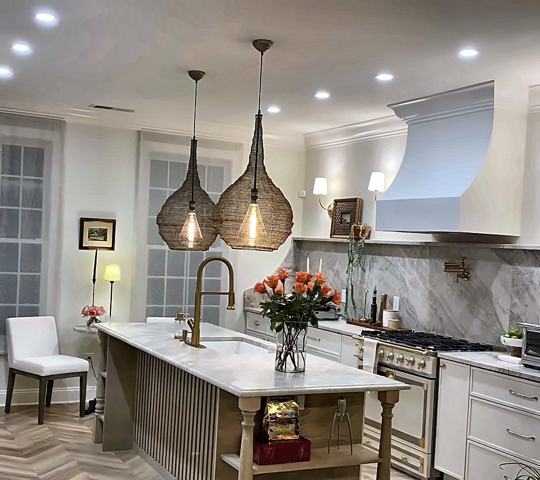 After: bright kitchen with custom island, woven pendants and herringbone floor