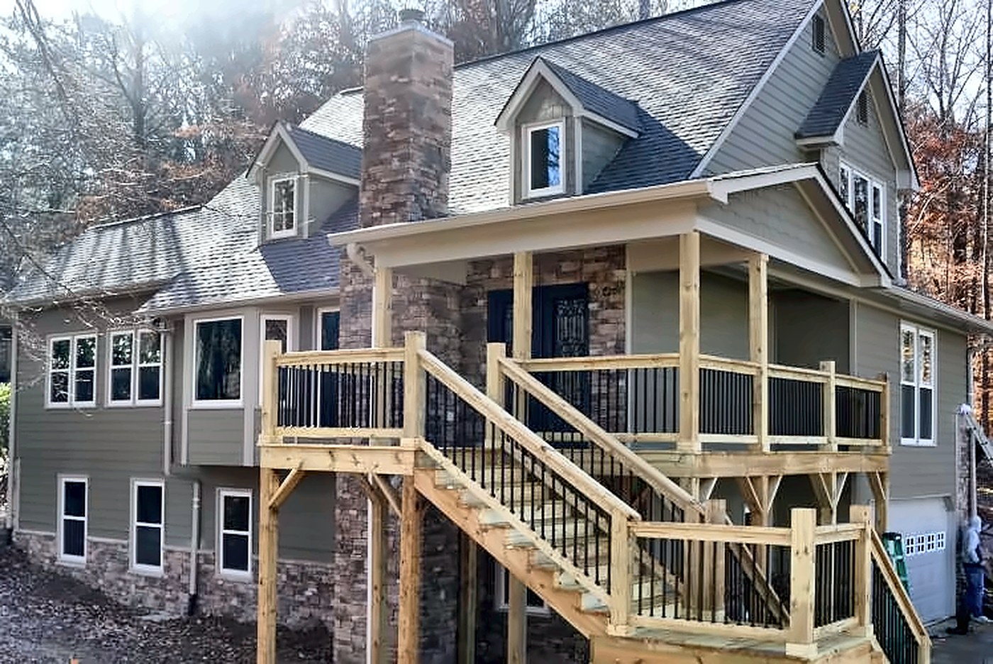 Craftsman exterior with stone chimney and new porch stairs