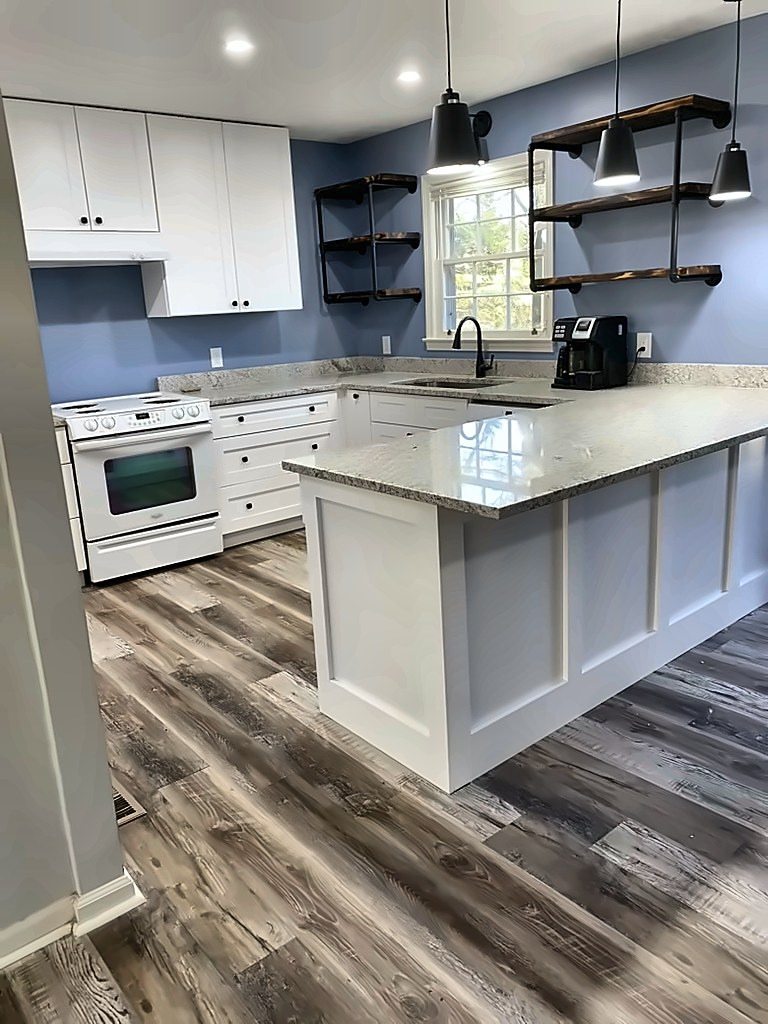 White shaker kitchen with granite peninsula and open shelving
