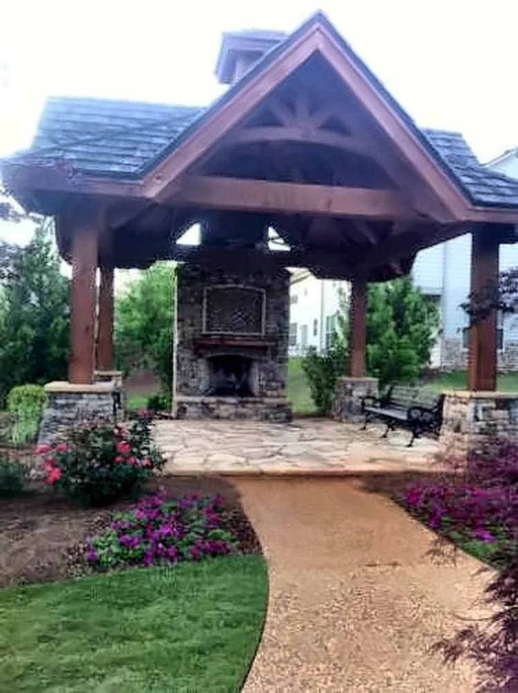 Timber-frame pavilion with stone fireplace